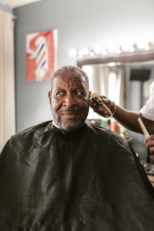 Customer getting a precise haircut in the barber chair